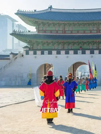 Traditional Korean palace guards in colorful uniforms performing ceremonial changing ceremony at Seoul's historic Gwanghwamun Gate