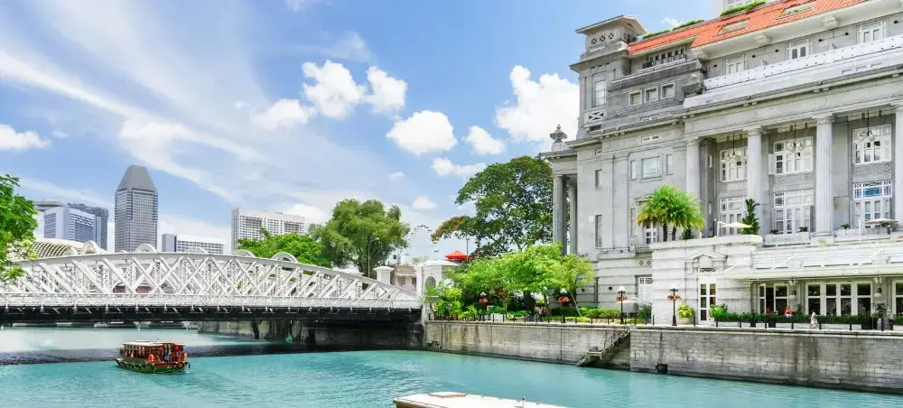 Singapore River waterfront showcasing colonial architecture and modern skyline for luxury travel destinations
