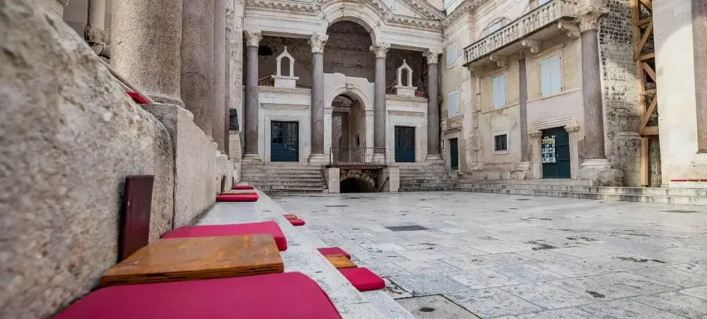 Historic stone courtyard in Split showcasing ancient Roman architecture and traditional Croatian heritage