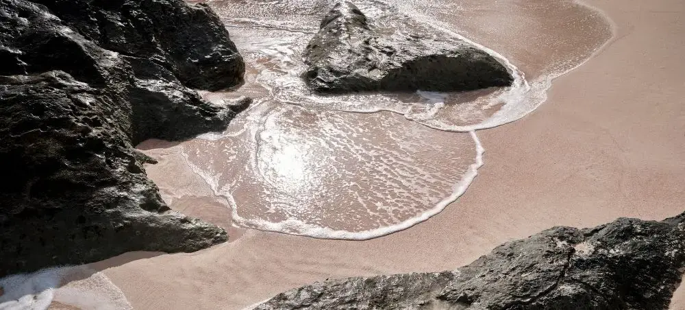 Pristine pink sand beach with dramatic rock formations in St Georges, Bermuda's historic coastal paradise