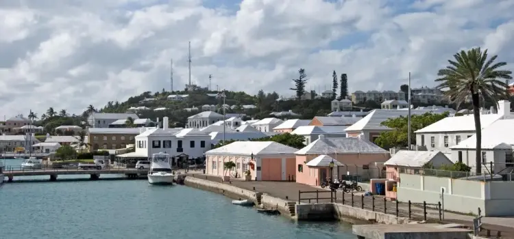 Historic St Georges waterfront in Bermuda showcasing colorful colonial buildings and pristine harbor waters