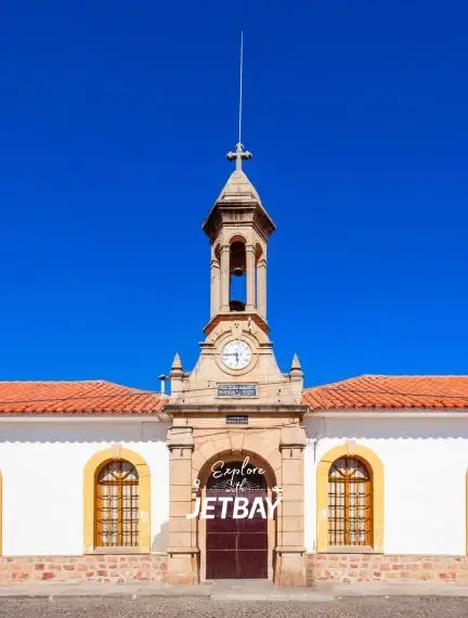 Historic colonial church with bell tower and red tile roof in Sucre Bolivia showcasing Spanish architecture
