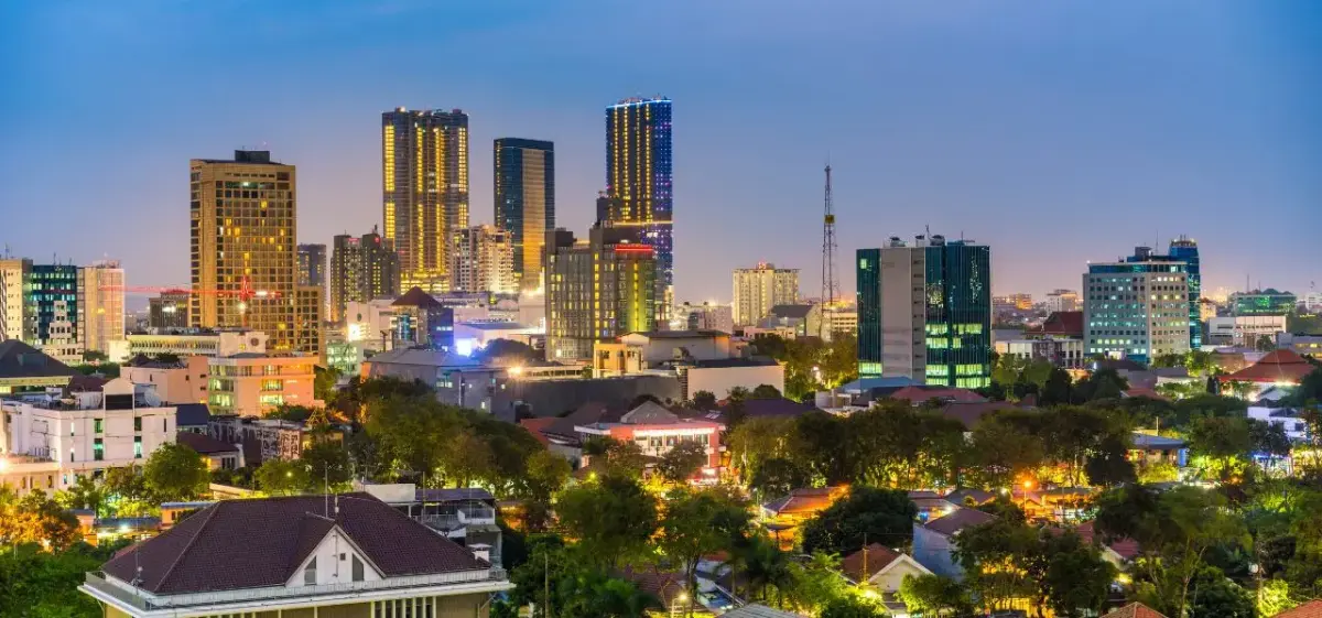 Surabaya city skyline at twilight showcasing illuminated skyscrapers and urban landscape in Indonesia
