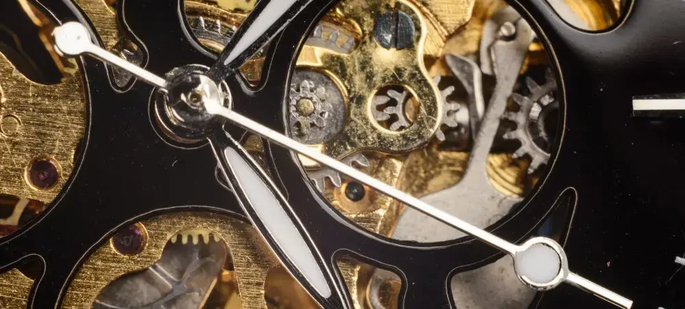 Precision Swiss watch mechanism with golden gears showcasing Switzerland's renowned craftsmanship and luxury