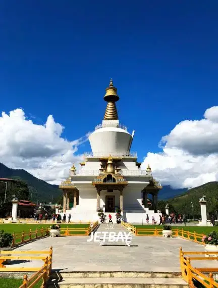 National Memorial Chorten Buddhist stupa in Thimphu with golden spire against blue sky and mountains