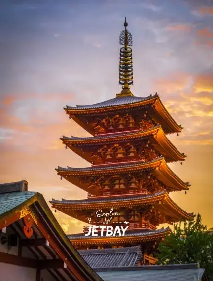 Traditional five-story pagoda illuminated at sunset showcasing Tokyo's historic architecture and cultural heritage