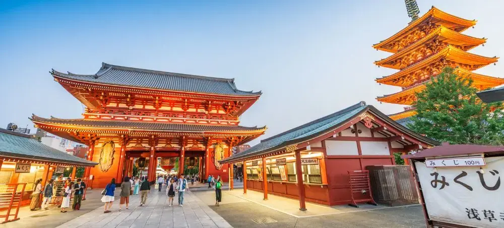 Illuminated Sensoji Temple complex in Tokyo showcasing traditional Japanese architecture for luxury travelers