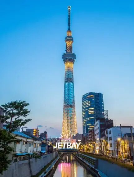 Tokyo Skytree illuminated at twilight with Jetbay branding, showcasing Japan's iconic tower and cityscape