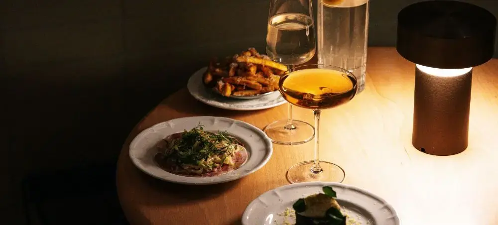 Elegant fine dining experience with gourmet dishes and wine showcasing Toronto's sophisticated culinary scene