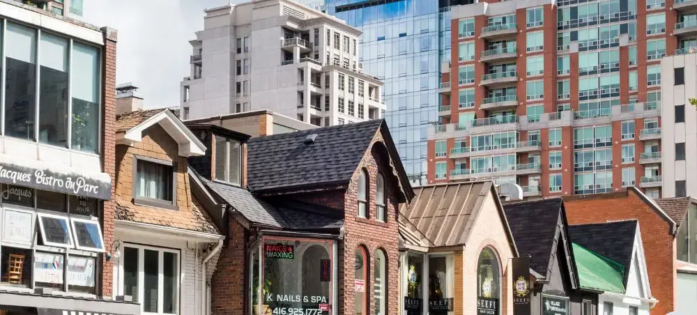 Historic brick buildings and modern high-rise towers showcase Toronto's diverse architectural landscape