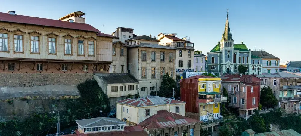Colorful historic buildings and colonial architecture cascading down hillsides in Valparaiso, Chile