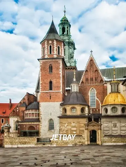 Historic Wawel Cathedral complex in Krakow showcasing Gothic and Renaissance architecture under cloudy skies