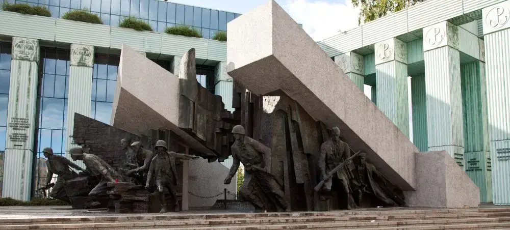 Warsaw Uprising Monument depicting Polish resistance fighters amid dramatic concrete blocks in Poland's capital