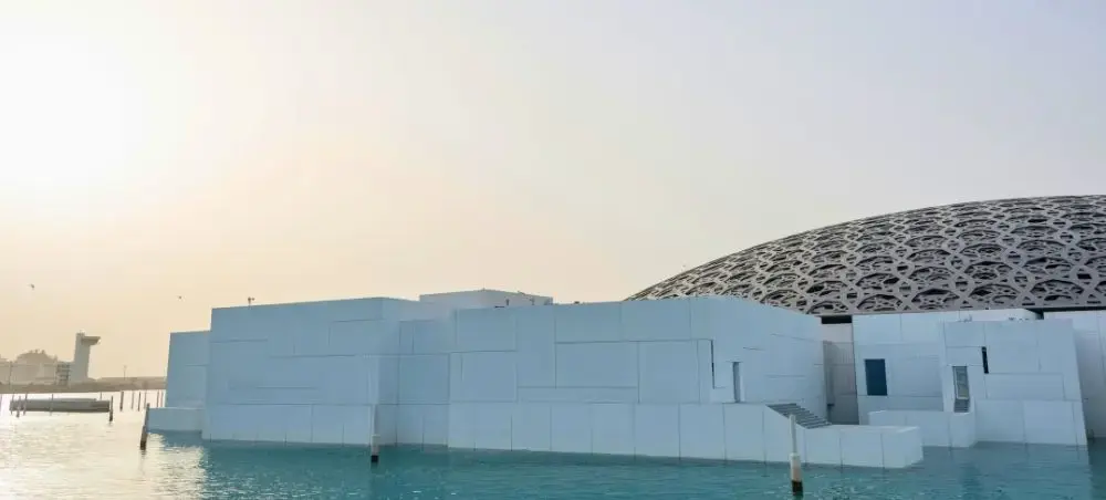 Waterfront promenade and landmark architecture in Abu Dhabi for private jet charter visitors