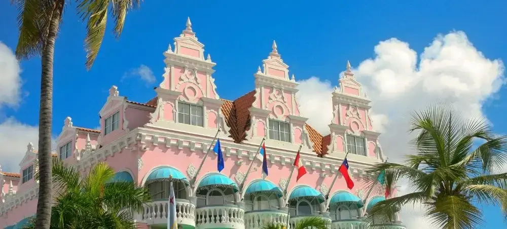 Waterfront promenade and landmark architecture in Oranjestad for private jet charter visitors