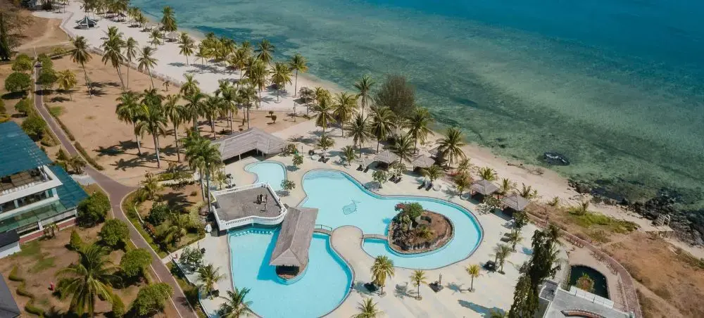 Waterfront promenade and landmark architecture in Seven Mile Beach for private jet charter visitors
