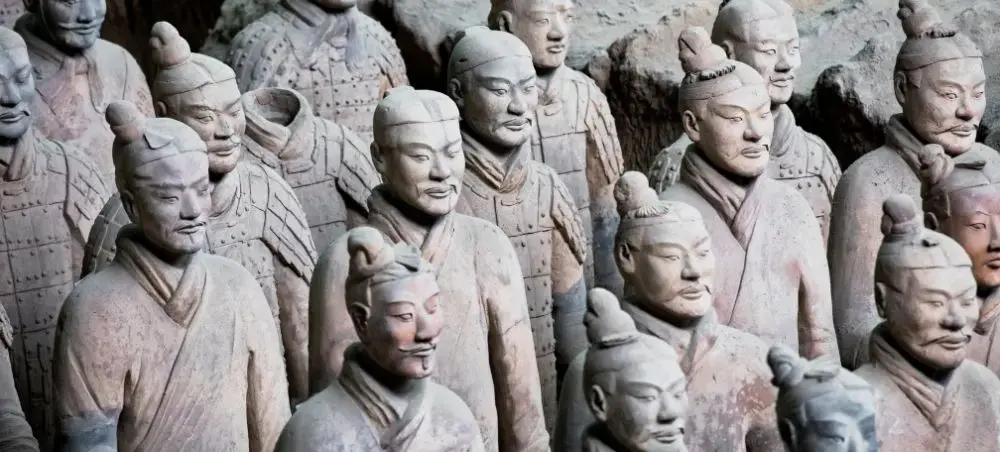 Ancient terracotta warriors standing in formation at Xi'an archaeological site in China