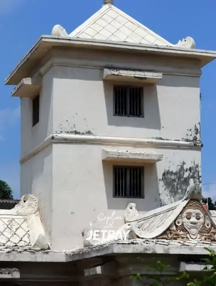 Historic white watchtower with traditional Indonesian architecture in Yogyakarta's cultural district