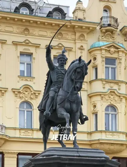 Historic equestrian statue of Ban Jelačić in Zagreb's main square with ornate Habsburg architecture