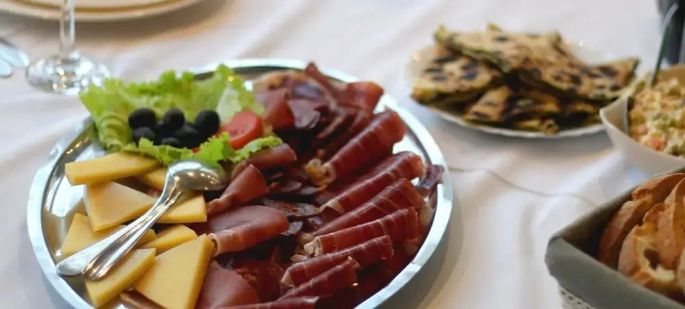 Gourmet Croatian charcuterie platter with local cheeses, cured meats, and olives served in Zagreb