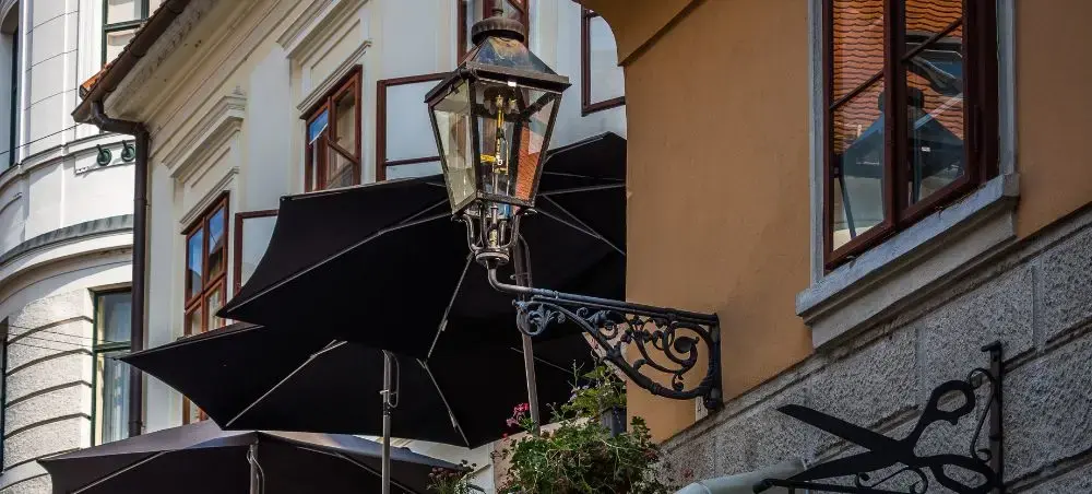 Historic Zagreb street scene with traditional gas lamp and colorful buildings showcasing Croatian architecture