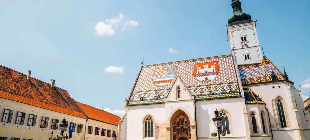 St. Mark's Church with colorful tiled roof and bell tower in Zagreb's historic Upper Town square