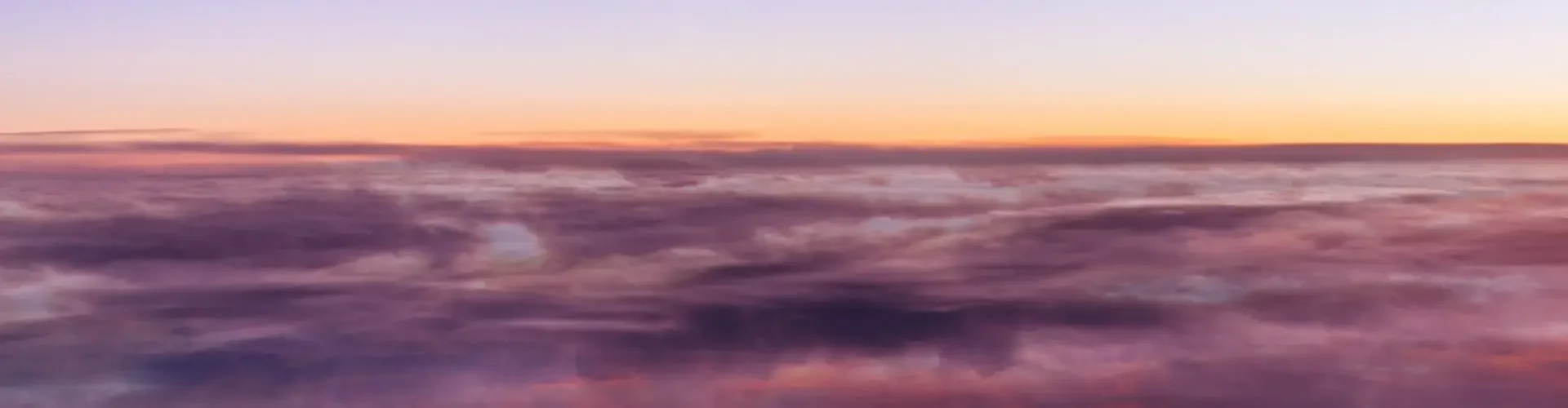 Private Jet Charters: Your Complete Guide for First-Time Flyers (Part 1) Luxury private jet soaring above golden clouds at sunset, showcasing premium business travel comfort
