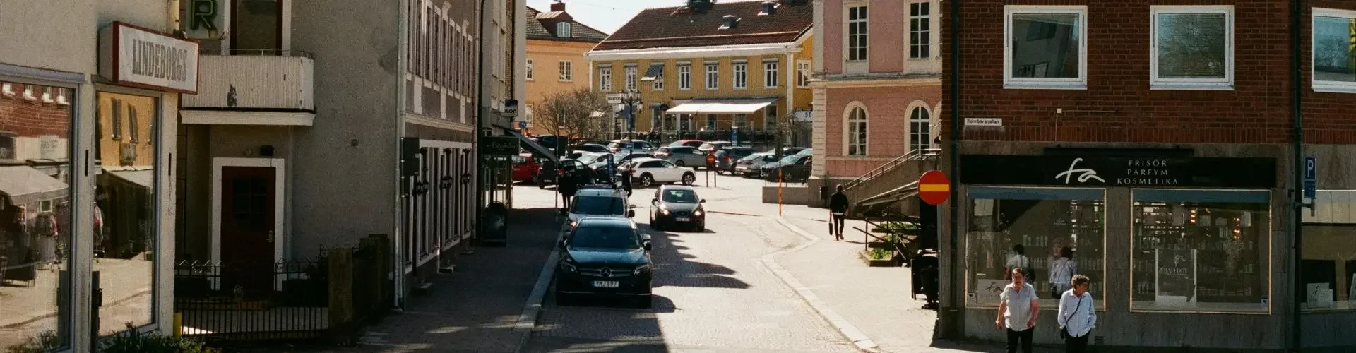 Charming European city street with historic buildings and cobblestones leading to Geneva destination