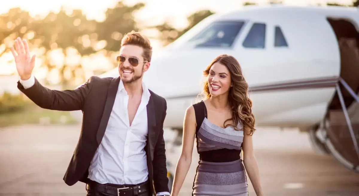 Elegant couple waving goodbye private jet terminal romantic for a valentines day departure