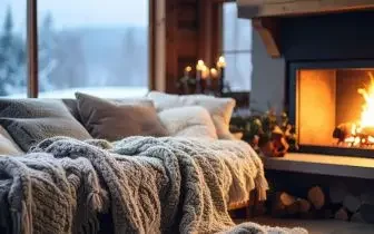 Cozy bedroom with fireplace and warm blankets perfect for luxury Christmas getaway accommodations