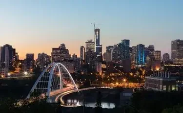 Private Jet Charter from Edmonton (CYEG) Edmonton skyline dusk illuminated walterdale bridge downtown towers private jet charter