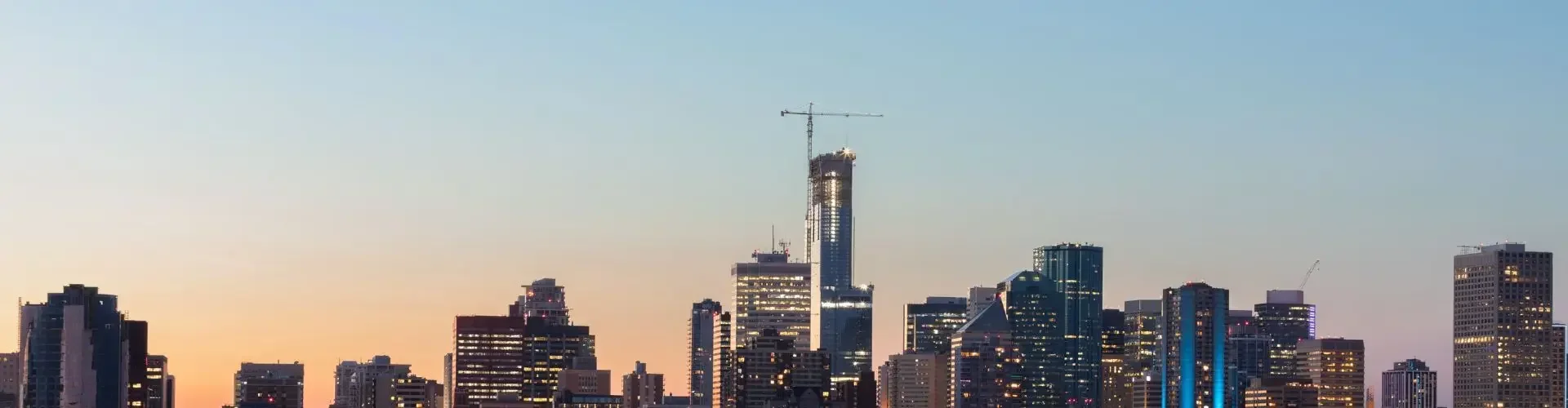 Private Jet from Edmonton to Yellowknife Edmonton skyline dusk illuminated walterdale bridge downtown towers private jet charter