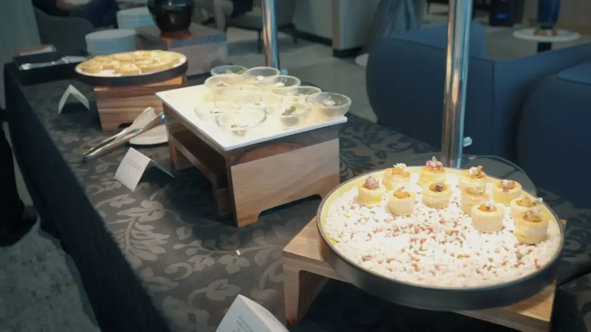 Elegant catering display featuring gourmet appetizers and beverages at exclusive Bombardier networking event
