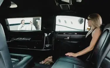 Charter Process: How to Book a Private Jet in Canada Elegant woman relaxing in luxurious private jet cabin interior during Canadian charter flight