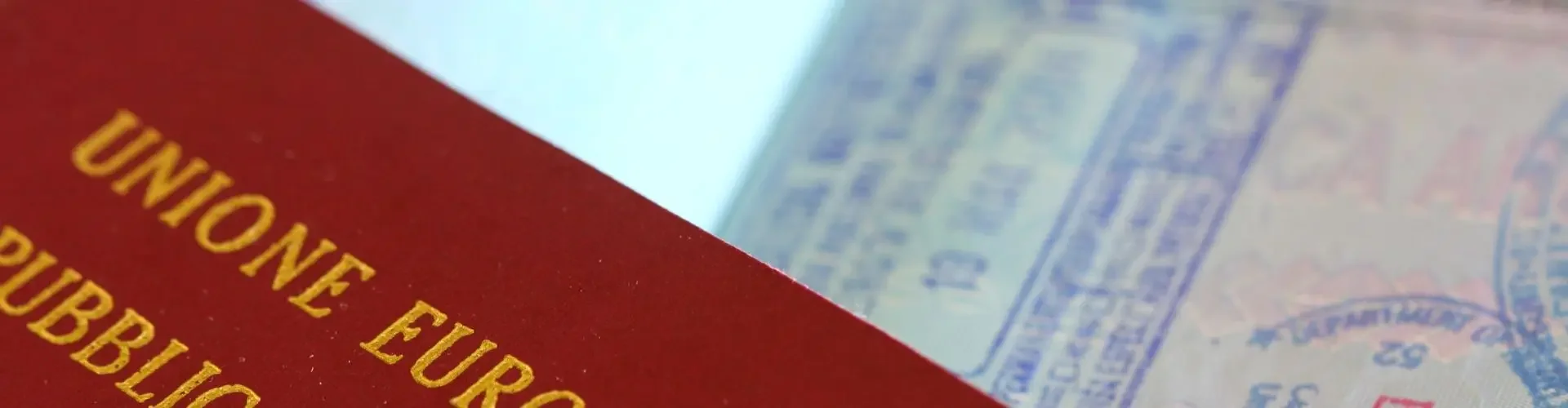 Italian passport with travel stamps showcasing international destinations for luxury jet travel