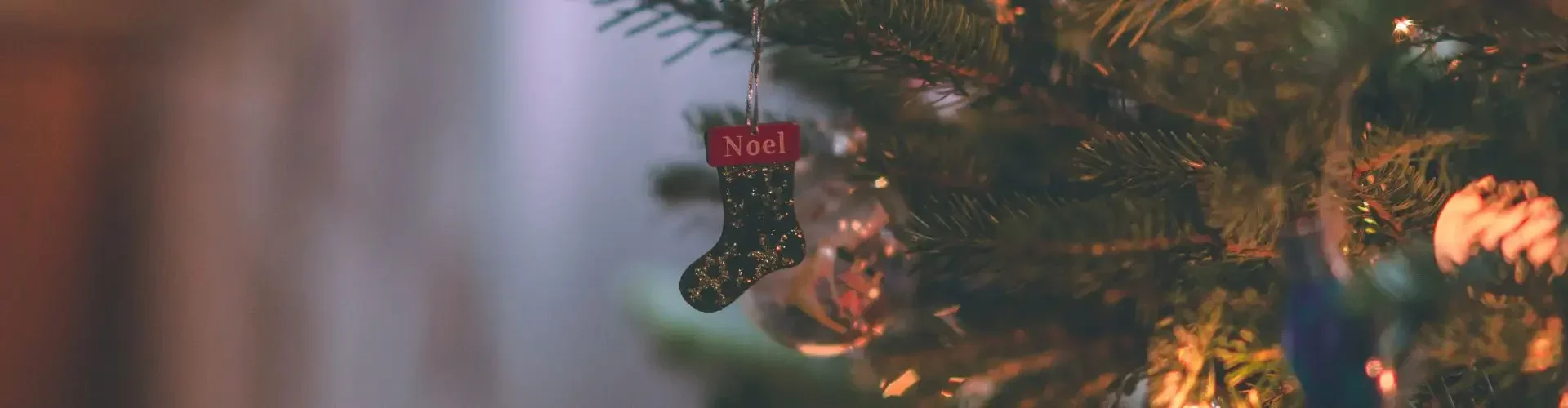 Festively decorated for a christmas tree warm golden lights ornaments holiday ambiance