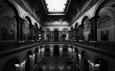 Grand museum interior with ornate arches and classical architecture reflecting luxury art curation standards