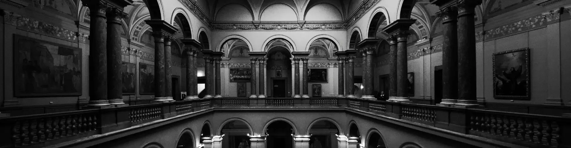 Grand museum interior with ornate arches and classical architecture reflecting luxury art curation standards