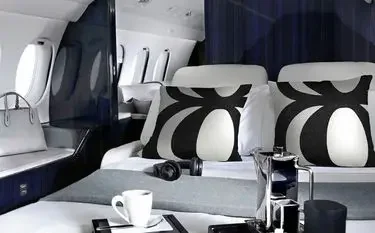 Luxurious private jet cabin interior with elegant seating and modern amenities for comfortable travel
