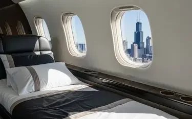 Luxurious private jet cabin interior with plush bedding and panoramic city skyline views through windows