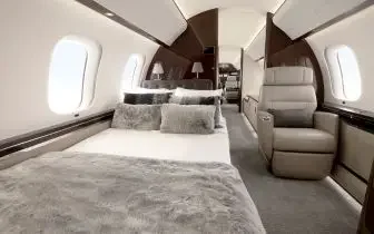 Luxurious private jet cabin interior featuring plush seating and elegant design for UK charter flights