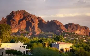 Private Jet from Scottsdale to Dallas Luxury desert homes nestled beneath dramatic red rock formations at golden hour in Scottsdale Arizona