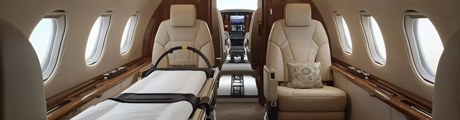 Medical aircraft interior with stretcher bed and luxury seating configured for air ambulance services