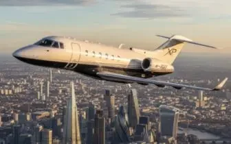 Luxury private jet flying above London cityscape showcasing premium charter services for UK flights