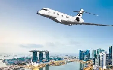 Luxury private jet soaring above Singapore's Marina Bay skyline with iconic towers and waterfront