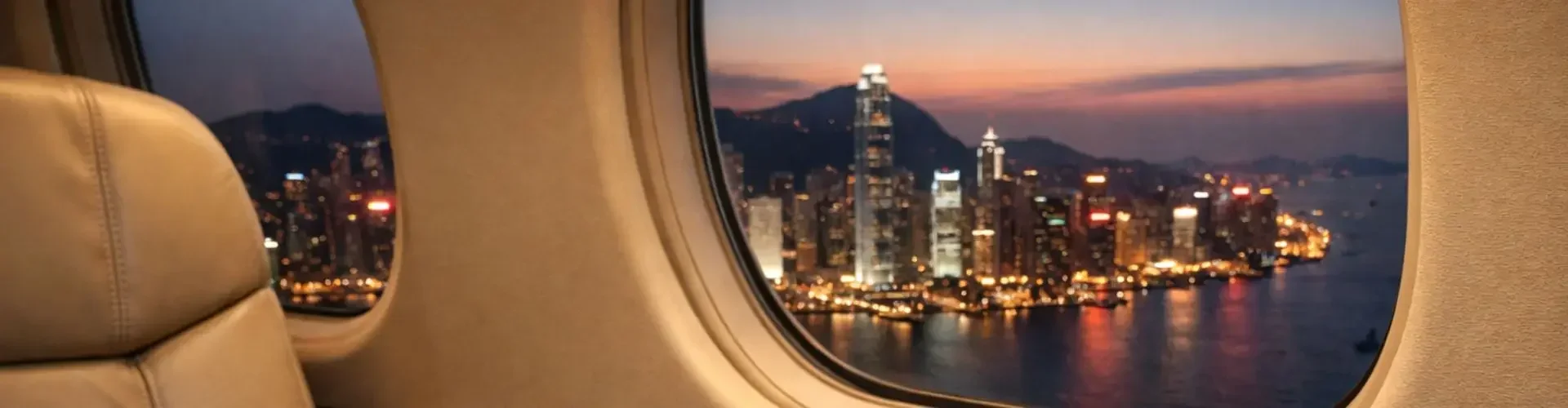 Luxury private private jet cabin art basel brochure whiskey hong kong skyline sunset