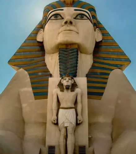 Majestic Egyptian pharaoh statue with golden headdress showcasing luxury destinations for exclusive birthday celebrations