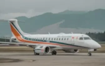 Medical air ambulance aircraft parked on tarmac with mountains in background for emergency transport