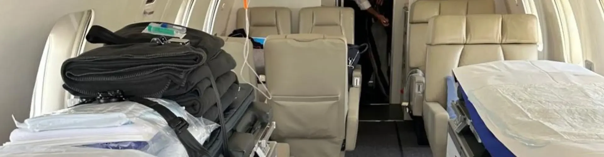 Medical equipment and stretcher bed inside air ambulance cabin configured for emergency patient transport