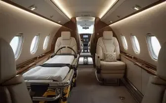 Medical evacuation aircraft interior with stretcher bed and luxury seating for air ambulance services